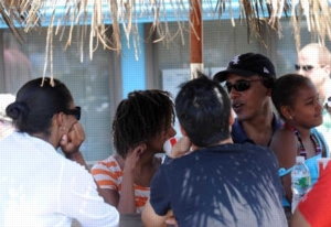 The Obama family waits to pick up their lunch at a restaurant in Oak Bluffs on Martha’s Vineyard last week.